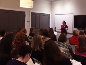 Jane Theriault leads a group of JL Boston members in a discussion of time management strategies.